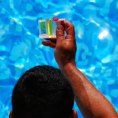 Pool skimmer basket being cleaned